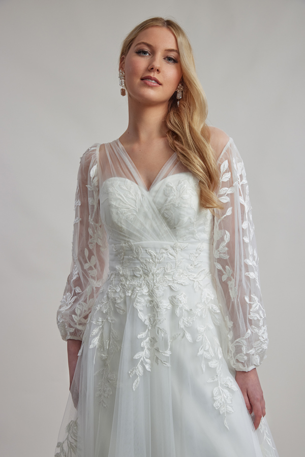 Leaf lace bridal dress with sleeves.