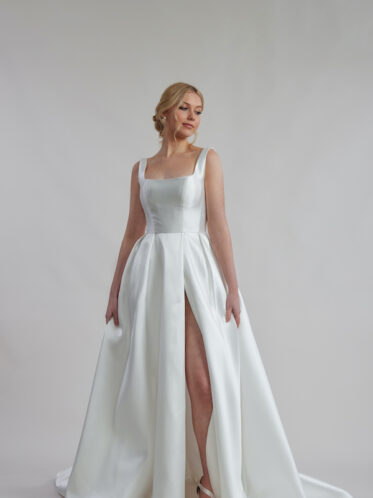 Ivory satin wedding dress without lace with side split.