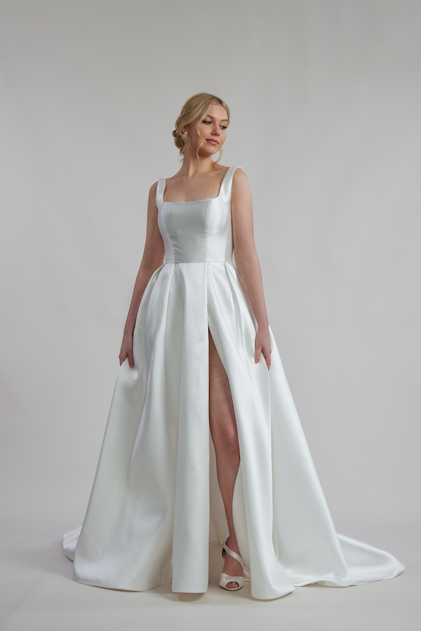 Ivory satin wedding dress without lace with side split.